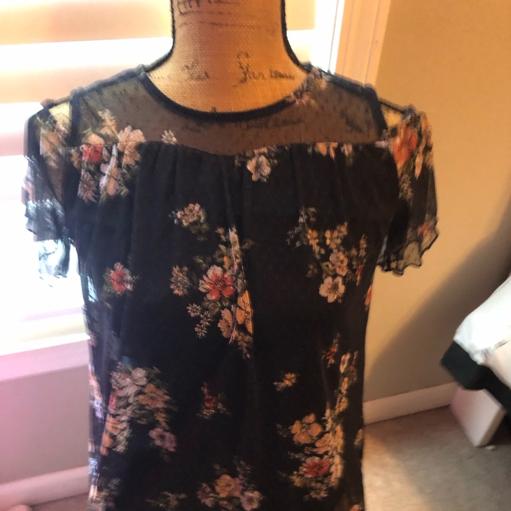 Black floral shirt.
